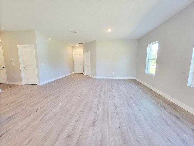 empty room with light wood-type flooring