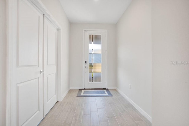 doorway with light hardwood / wood-style floors