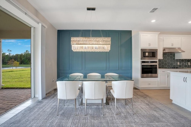 dining area with light wood-type flooring