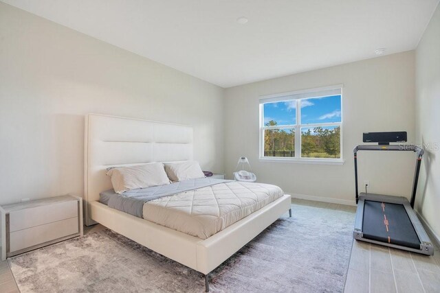 bedroom with light hardwood / wood-style floors