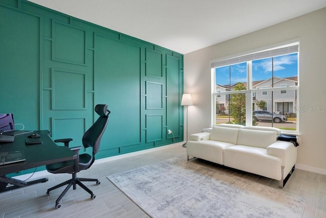 office area with light hardwood / wood-style floors