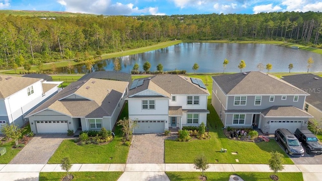 birds eye view of property with a water view