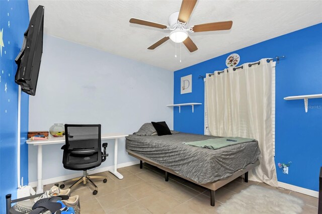 tiled bedroom with ceiling fan