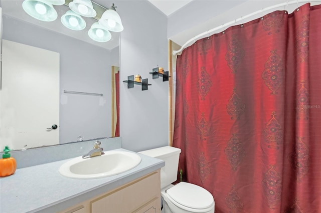 bathroom featuring vanity, toilet, and a shower with shower curtain