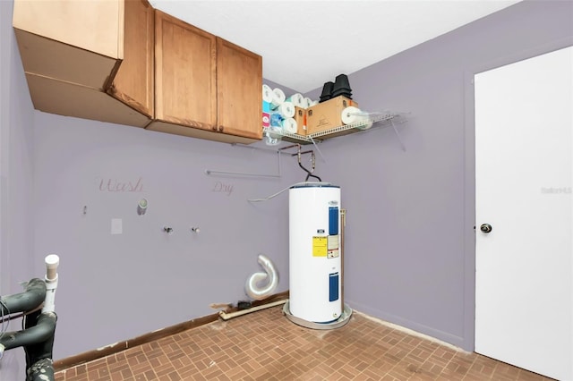 washroom with cabinets and electric water heater