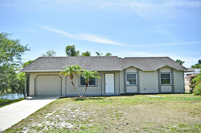 ranch-style home with a front lawn and a garage