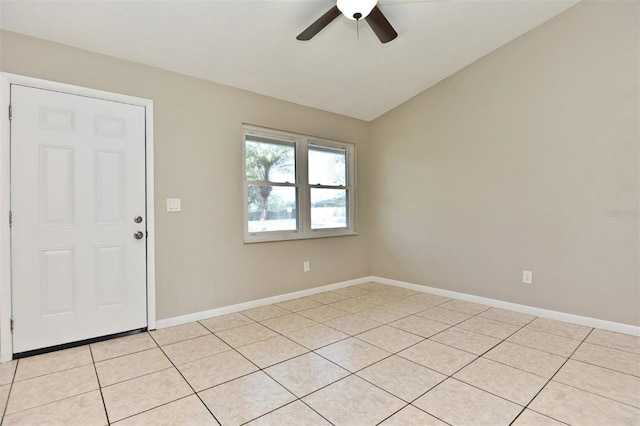 tiled foyer with ceiling fan and vaulted ceiling