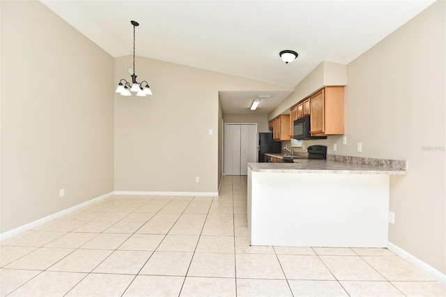 kitchen featuring a notable chandelier, lofted ceiling, hanging light fixtures, black appliances, and light tile patterned floors