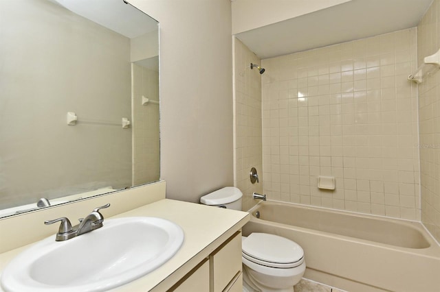 full bathroom with vanity, toilet, and tiled shower / bath combo