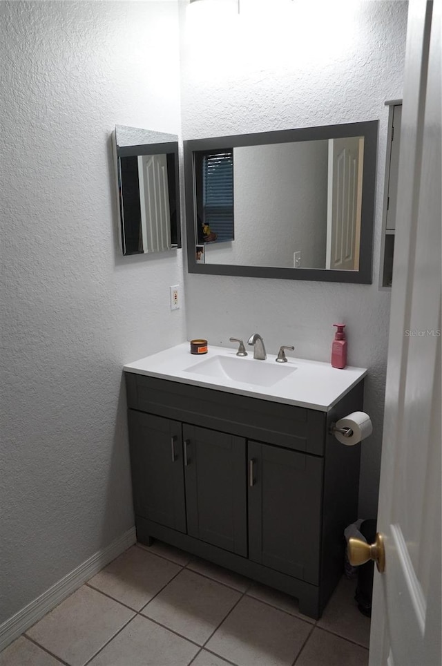 bathroom with vanity and tile patterned flooring