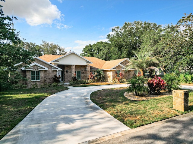 ranch-style house with a front lawn