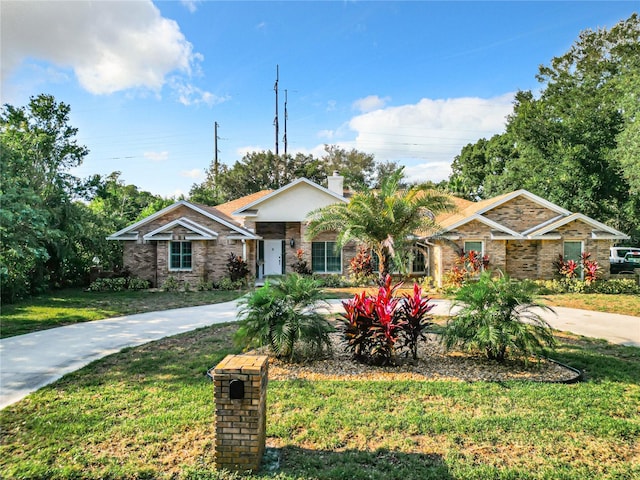 ranch-style home featuring a front yard