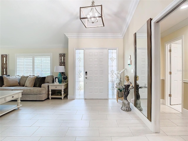 foyer with ornamental molding, light tile patterned flooring, and an inviting chandelier