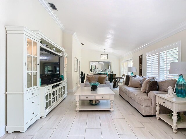 living room featuring crown molding