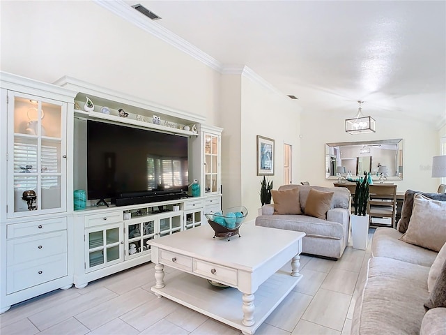 living room with crown molding and a chandelier