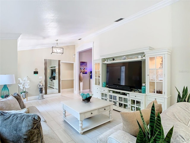 living room featuring a notable chandelier and ornamental molding