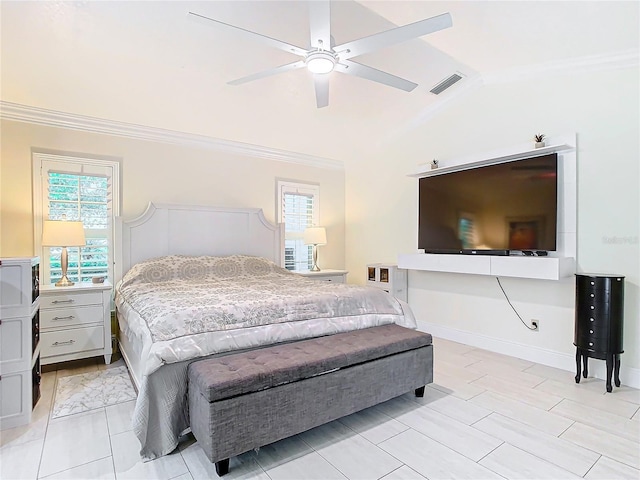 bedroom featuring lofted ceiling, ornamental molding, and ceiling fan