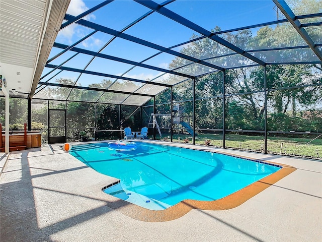 view of pool with a patio, a lanai, and a hot tub