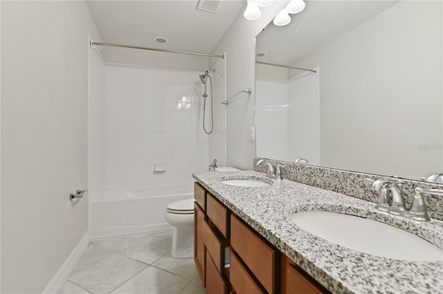 full bathroom featuring toilet, tiled shower / bath, vanity, and tile patterned floors