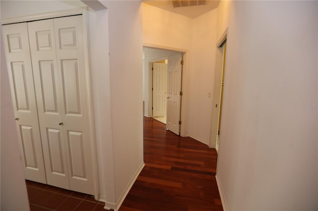 hallway featuring dark hardwood / wood-style flooring