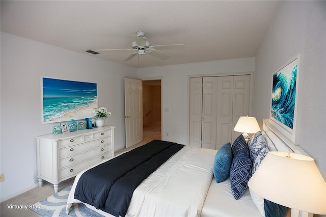 bedroom with light carpet, a closet, and ceiling fan