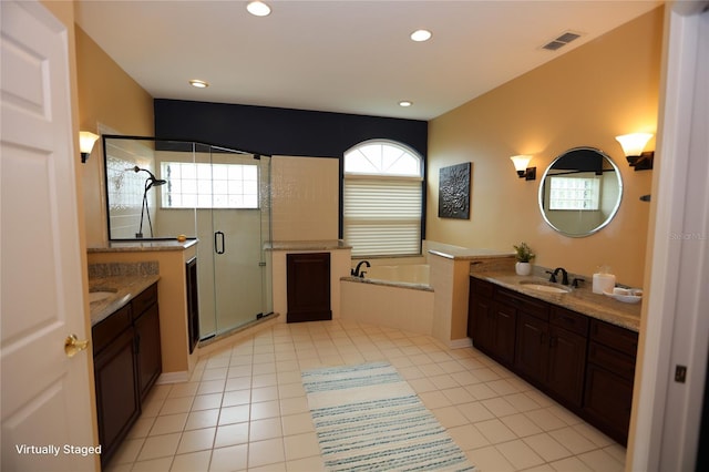 bathroom featuring vanity, tile patterned floors, and plus walk in shower