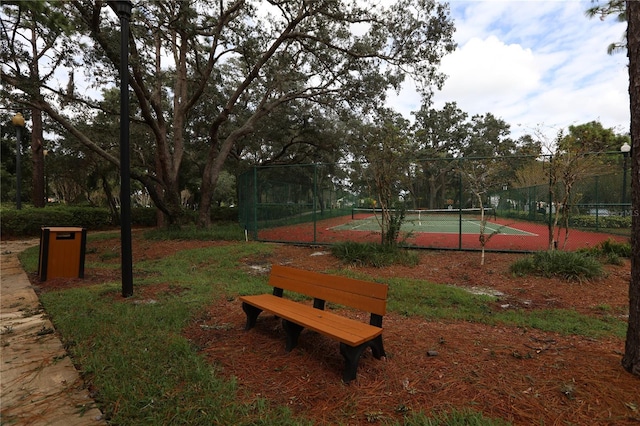 view of property's community with tennis court