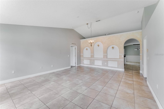 interior space featuring a notable chandelier and vaulted ceiling