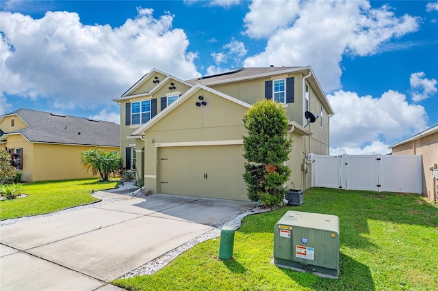 view of front facade with a garage and a front lawn