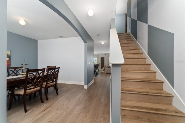 dining area featuring wood-type flooring