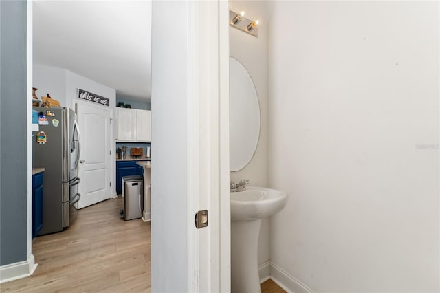 bathroom with hardwood / wood-style floors