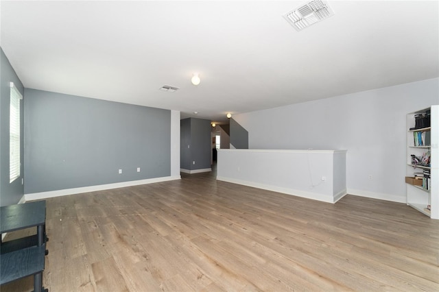 unfurnished living room featuring light wood-type flooring