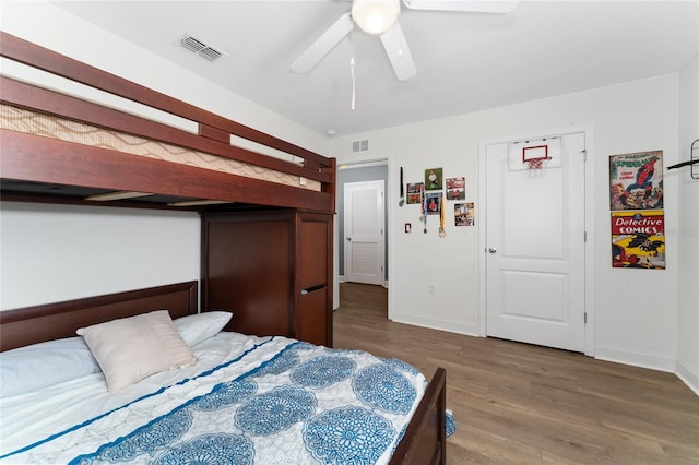 bedroom with ceiling fan and hardwood / wood-style floors