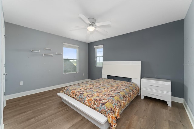 bedroom with hardwood / wood-style flooring and ceiling fan