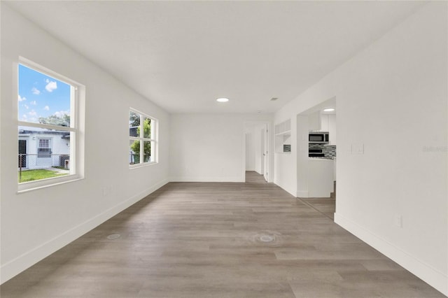 1004 Jersey St, Cocoa, FL 32927 - unfurnished room featuring recessed lighting, baseboards, and wood finished floors