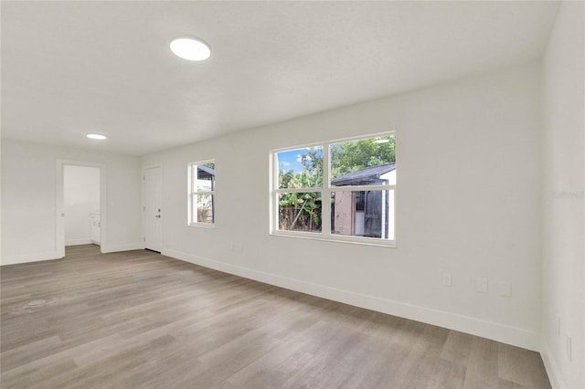 spare room featuring light hardwood / wood-style floors