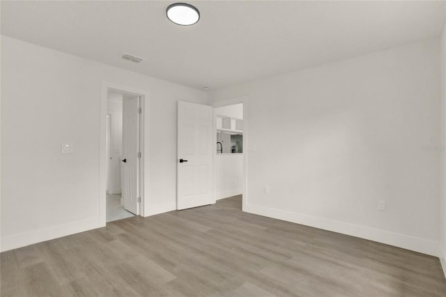 1004 Jersey St, Cocoa, FL 32927 - unfurnished room featuring wood finished floors and baseboards