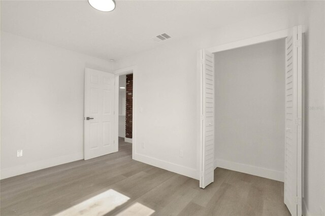 1004 Jersey St, Cocoa, FL 32927 - unfurnished bedroom with wood finished floors and baseboards