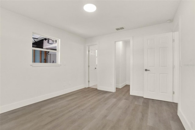 1004 Jersey St, Cocoa, FL 32927 - unfurnished bedroom featuring wood finished floors and baseboards