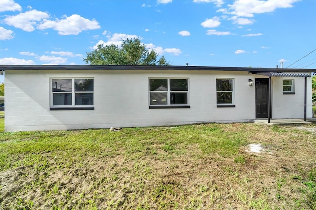 1004 Jersey St, Cocoa, FL 32927 - view of front of home featuring concrete block siding and a front yard