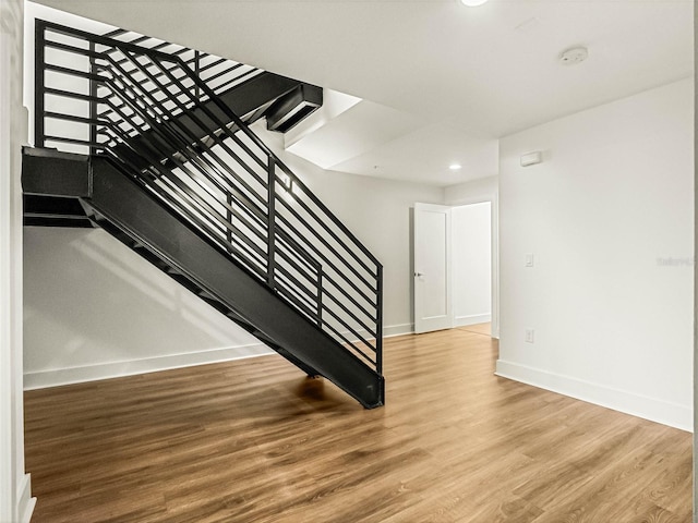 stairway featuring hardwood / wood-style floors