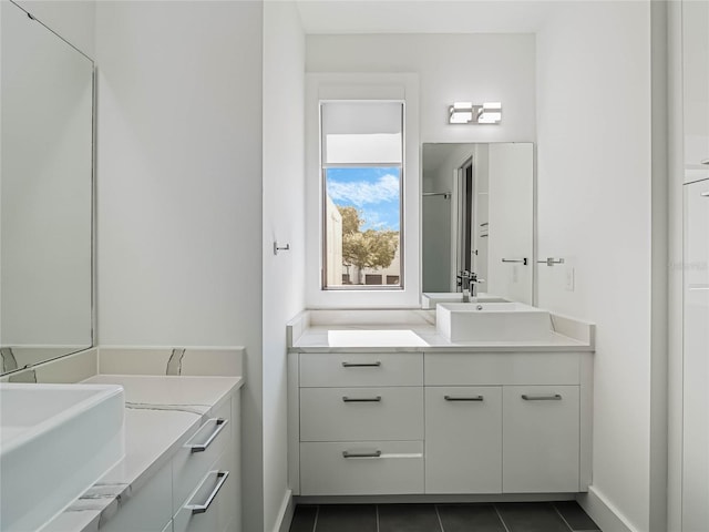 bathroom with tile patterned floors and vanity