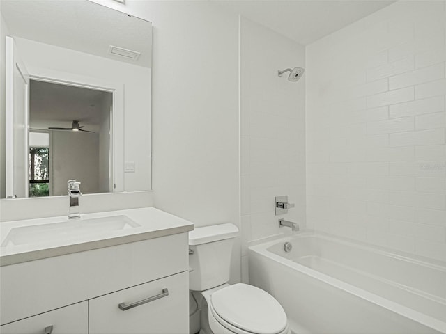 full bathroom featuring toilet, vanity, and tiled shower / bath combo