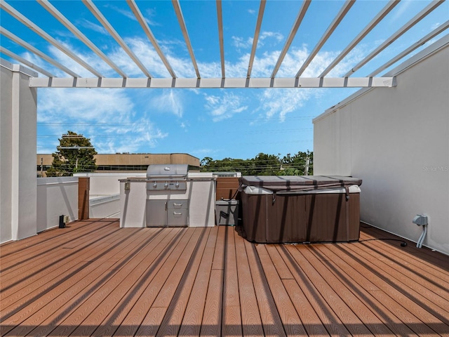 wooden terrace featuring area for grilling, a hot tub, and a pergola