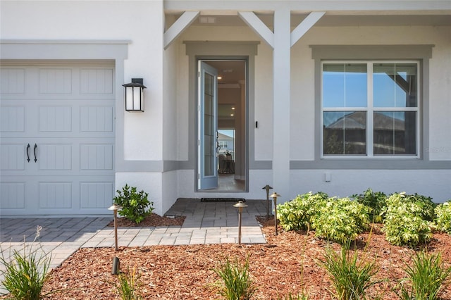 doorway to property featuring a garage