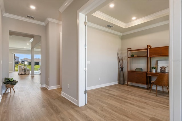 interior space with ornamental molding and light wood-type flooring