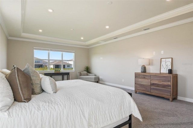 bedroom featuring crown molding, carpet floors, and a tray ceiling