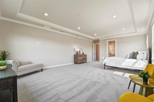 carpeted bedroom featuring crown molding and a tray ceiling