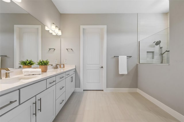 bathroom with vanity and a shower