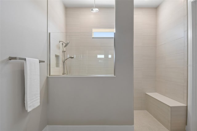 bathroom featuring a tile shower